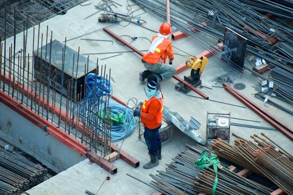 Trade workers on excavated site — backwater valve installation Toronto