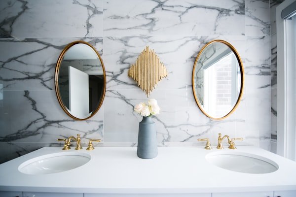Premium bathroom with gold fixtures — gas line plumbing and TSSA-permitted appliance hook-ups