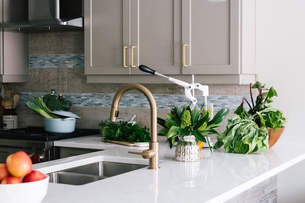 Modern kitchen with sink and faucet — water heater installation and conversion services